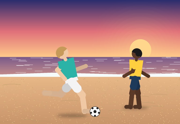 Two beach soccer players at sunset